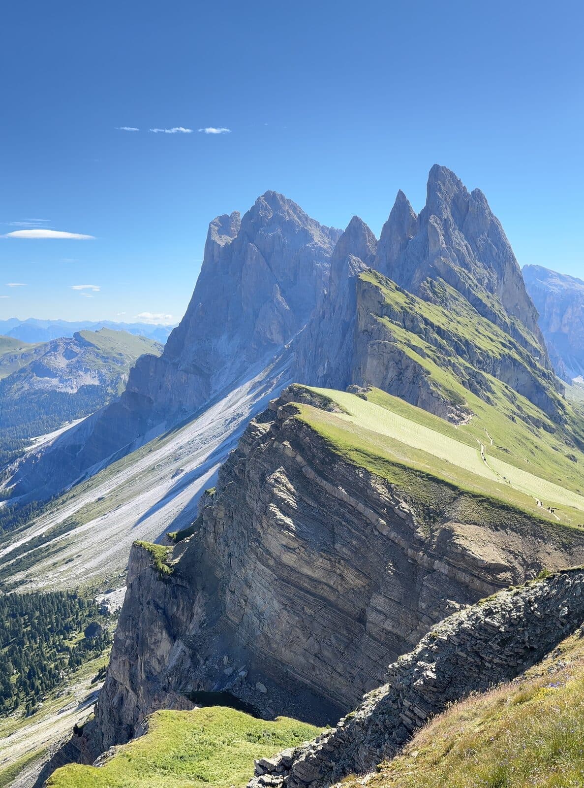 The jagged Odle peaks rising above the grassy Seceda ridge in the Dolomites